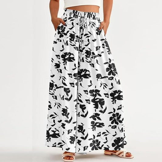 🌸 Pantaloni cu talie înaltă și picior larg, cu imprimeu floral – ușori și fluizi – spate elastic, perfecți pentru vară sau vacanțe la resort – eleganți și comozi ✨