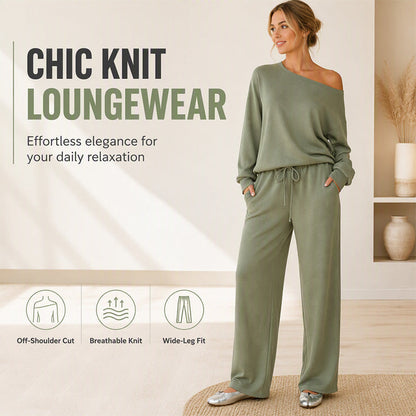Costum de damă cu top tip off-shoulder și pantaloni evazați