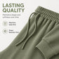 Costum de damă cu top tip off-shoulder și pantaloni evazați
