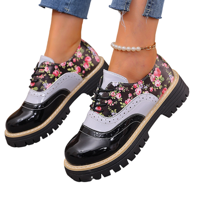 Damesbrogues met bloemenprint en plateauzool
