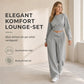 Tvdelad set i avslappnad sportig stil för höst och vinter, bestående av långärmad t-shirt och vida byxor med skärning i midjan