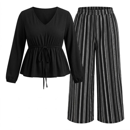 Peplum-topp med V-ringning i dammodell och randig byxdress