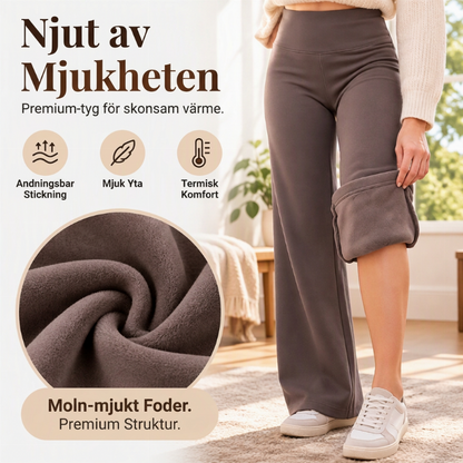Dambyxelkläder med hög midja, fodrade med mjukt plysch och formade som flare-byxor