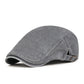 🧢 Neutralt utformad beret i vintage-stil med sliten look, i flatkepsstil